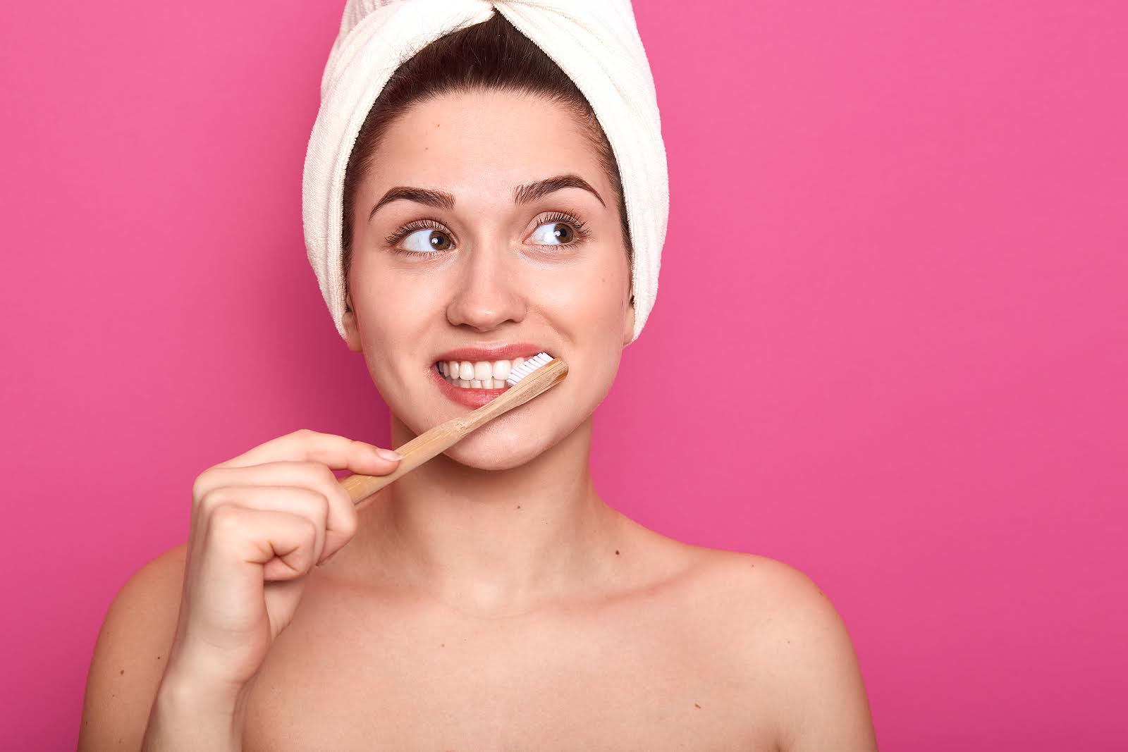 Person brushing teeth to help reduce braces gum inflammation and maintain healthy gums