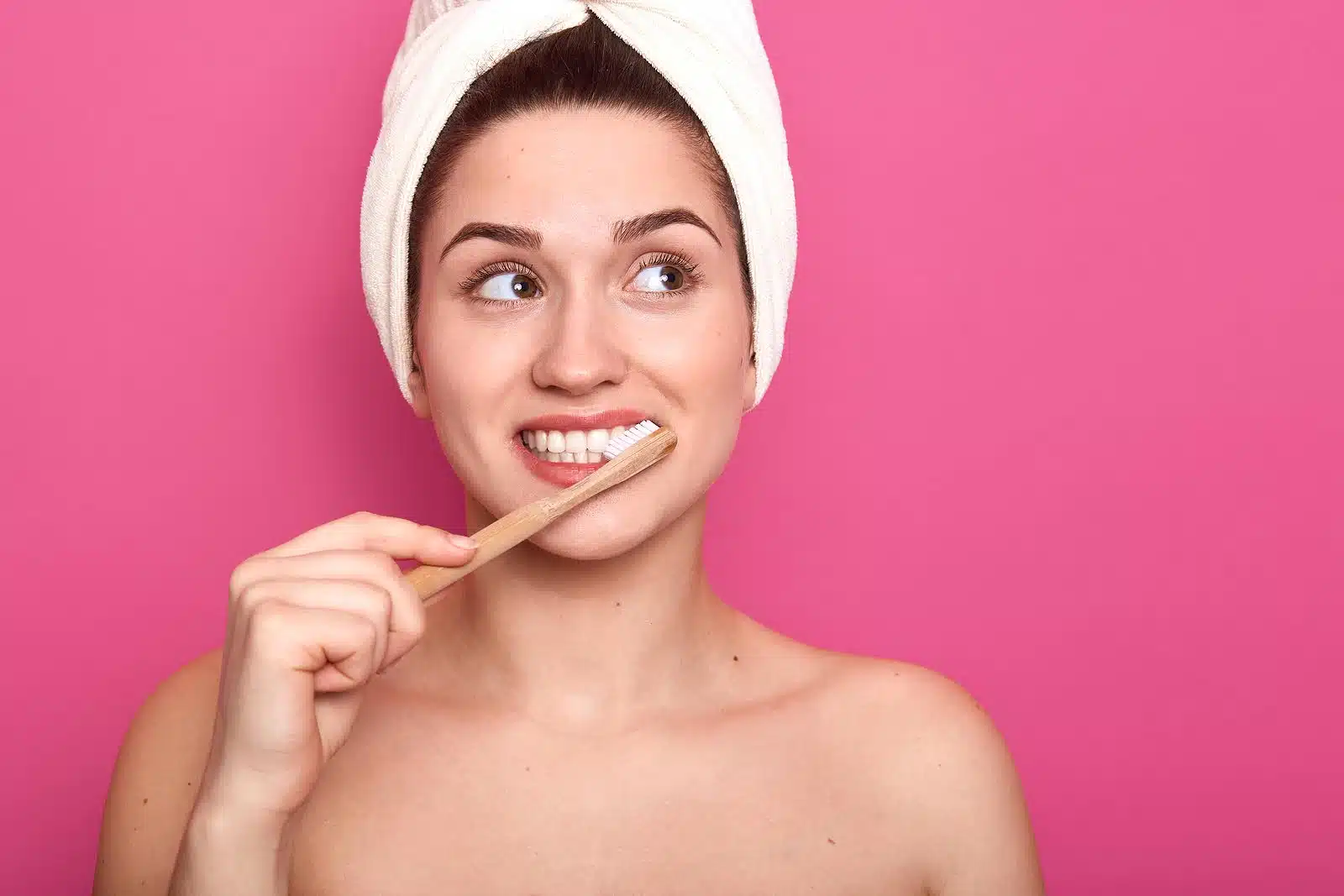 Person brushing teeth to help reduce braces gum inflammation and maintain healthy gums