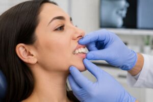 orthodontist evaluating overbite before Invisalign treatment